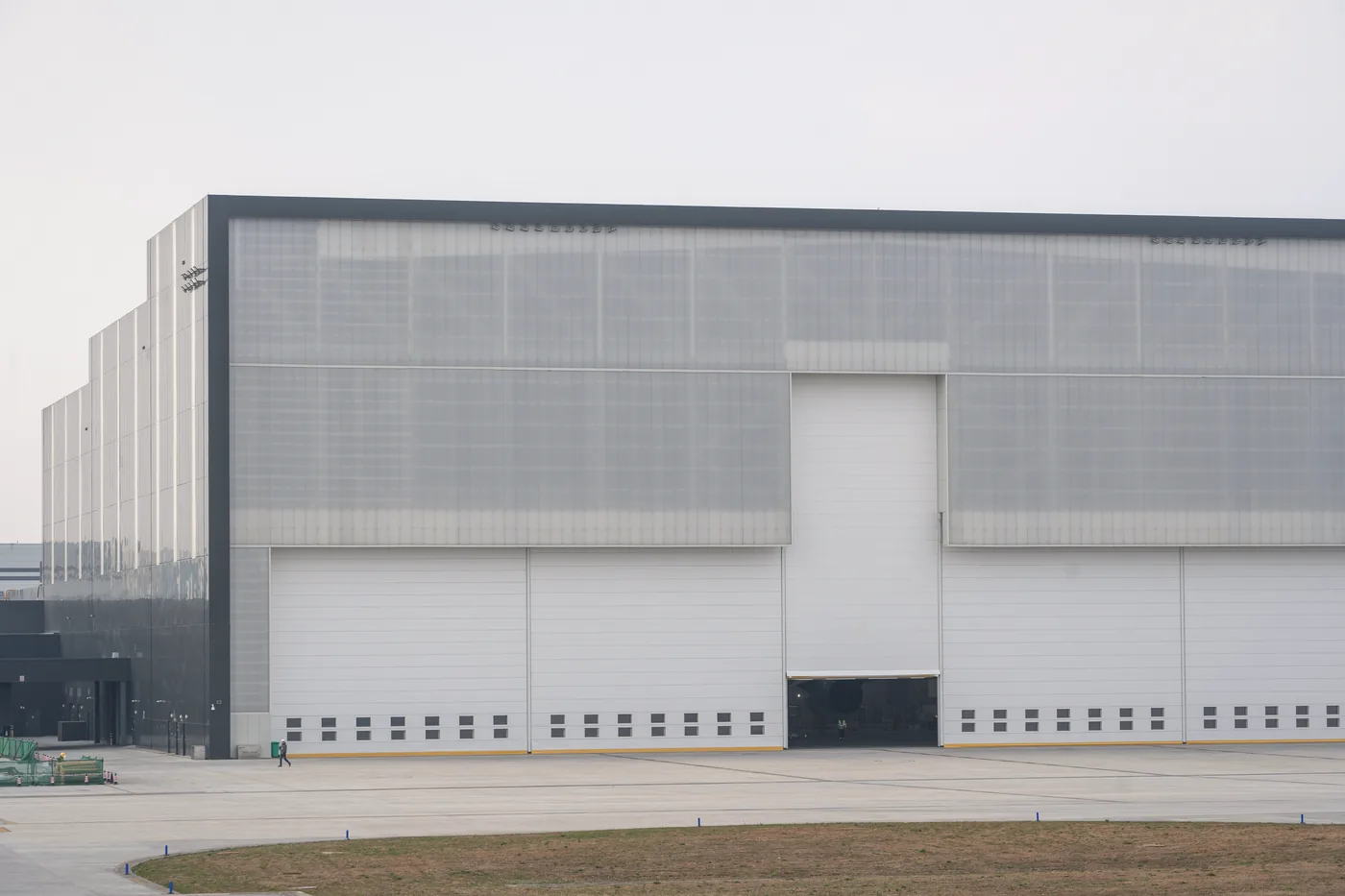 A commercial logistics facility photographed in flat daylight